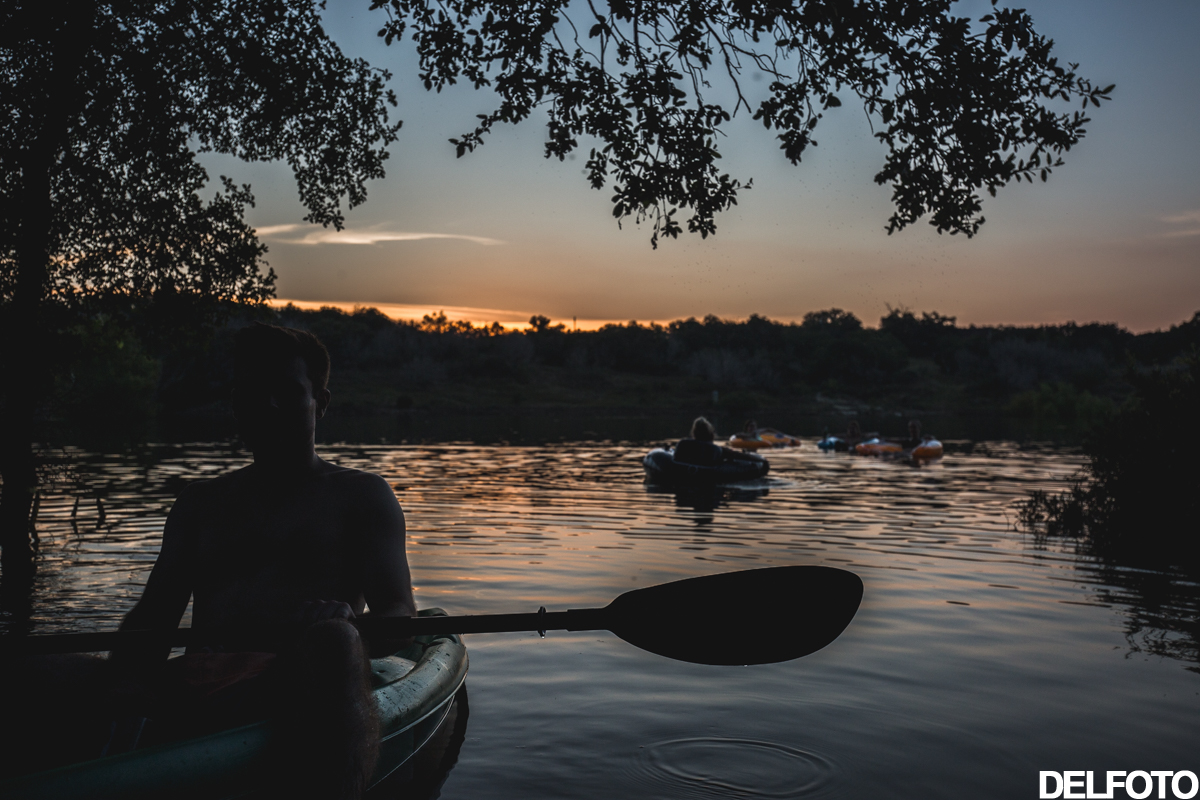 austin texas camp krause springs day trip kayak paddle creek lake silhouette portrait
