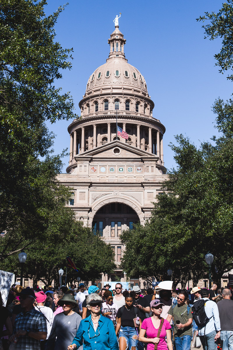 texas capitol building promenade with protesters from women's march on austin