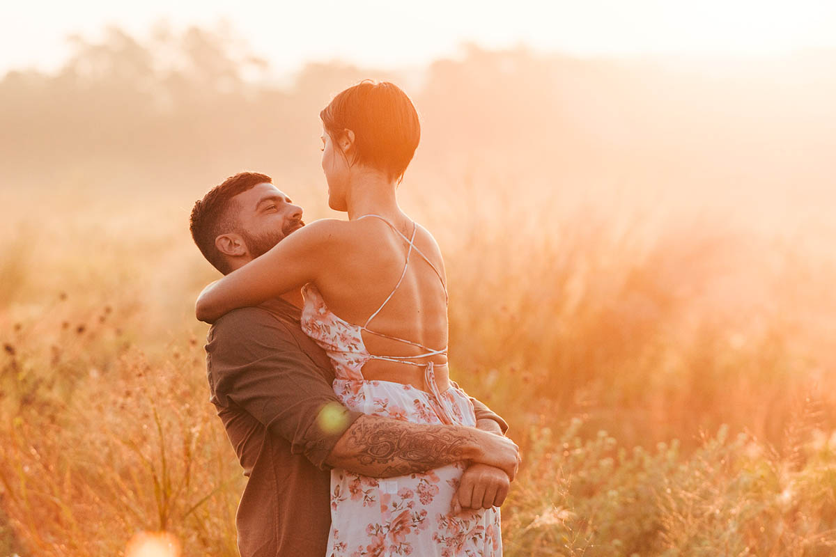 engaged couple hazy sunrise commons ford park engagement photography