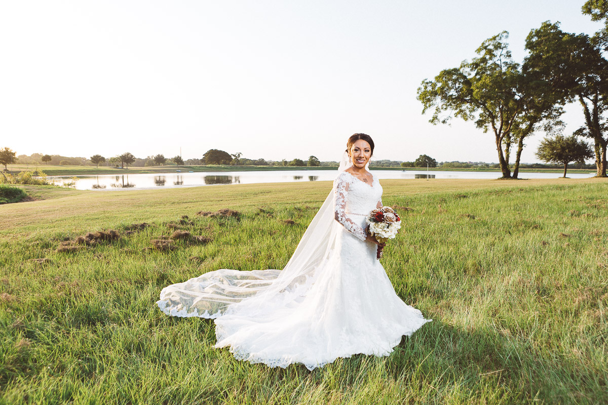 bride standing lakefront chappell hill texas